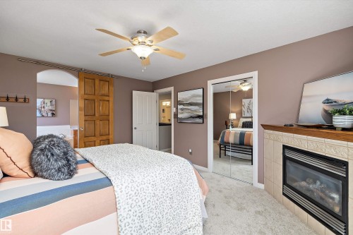 2311 Bailey Court, Edmonton, AB - Indoor Photo Showing Bedroom With Fireplace