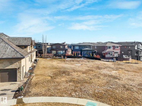 Expansive, undeveloped lot featuring a gentle incline and a clear view of surrounding residences - 2794 Wheaton Drive, Edmonton, AB 