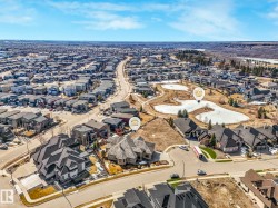 Sprawling residential development featuring a network of paved roads and varied home styles - 
