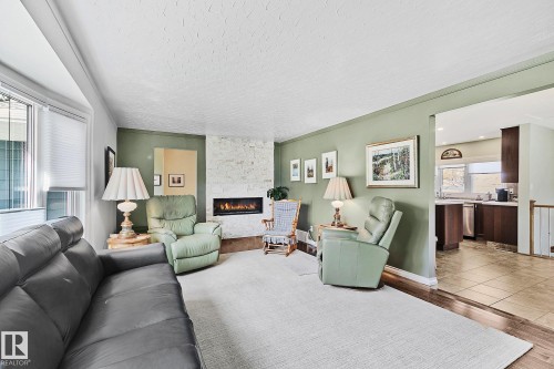 4704 109 Avenue, Edmonton, AB - Indoor Photo Showing Living Room With Fireplace