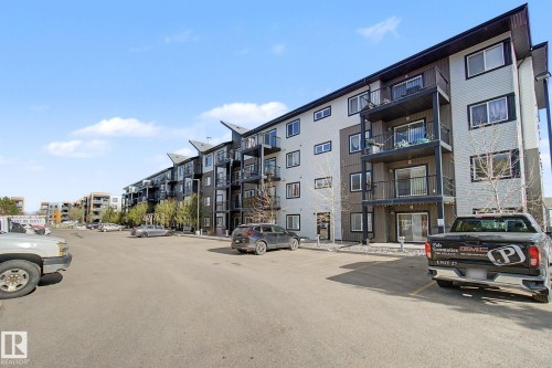 Multi-story residential building featuring balconies and a combination of light and dark exterior siding - 334 504 Albany Way, Edmonton, AB - Outdoor With Balcony With Facade