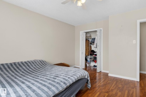 Wood-finish flooring throughout - 26E Meadowlark Village, Edmonton, AB - Indoor Photo Showing Bedroom