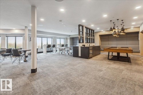 OWNER AMENITY - OWNER CASUAL USE OR RESERVE IT FOR YOUR PRIVATE FUNCTION. EQUPPED WITH 2 BIG SCREEN TV'S, POOL TABLE, TABLE TENNIS TABLE, DART BOARD, VIDEO GAME CONSOLE, BAR FRIDGES, GAMES AND PLENTY OF SEATING - 428 7463 May Common, Edmonton, AB - Indoor