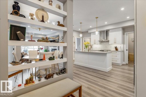 UNIT ENTRANCE WITH BUILT IN  SHELVES - 428 7463 May Common, Edmonton, AB - Indoor Photo Showing Kitchen With Upgraded Kitchen