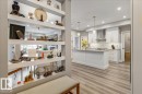 UNIT ENTRANCE WITH BUILT IN  SHELVES - 428 7463 May Common, Edmonton, AB  - Indoor Photo Showing Kitchen With Upgraded Kitchen 