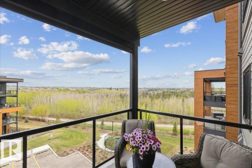 SPECTACULAR RAVINE AND DOWNTOWN VIEWS. SOLARIS POWERED SCREEN TO SHEILD THE SUN - 405 7463 May Common, Edmonton, AB - Outdoor With View With Exterior