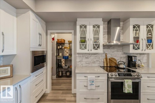 ADDITIONAL STORAGE WITH THE KITCHEN PANTRY - 405 7463 May Common, Edmonton, AB - Indoor Photo Showing Kitchen