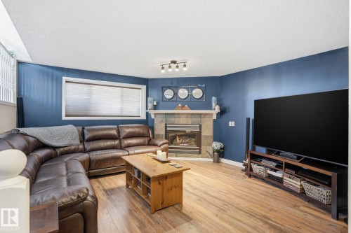 5410 57 Avenue, Beaumont, AB - Indoor Photo Showing Living Room With Fireplace