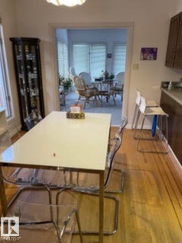 Hardwood-style flooring throughout the dining area - 9126 117 Street, Edmonton, AB 