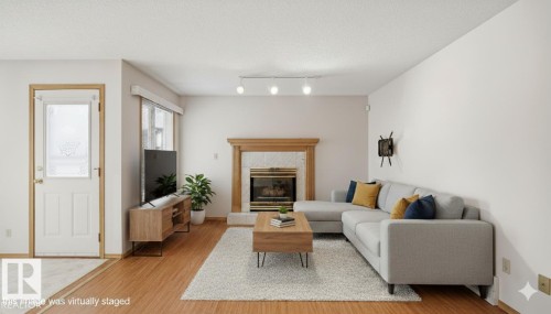 Edmonton, AB - Indoor Photo Showing Living Room With Fireplace