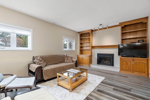 229 Northmount Drive, Wetaskiwin, AB - Indoor Photo Showing Living Room With Fireplace