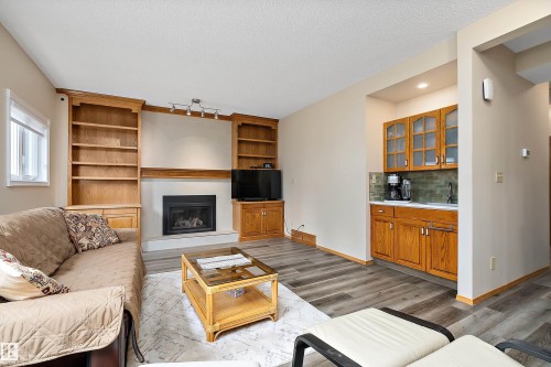 229 Northmount Drive, Wetaskiwin, AB - Indoor Photo Showing Living Room With Fireplace