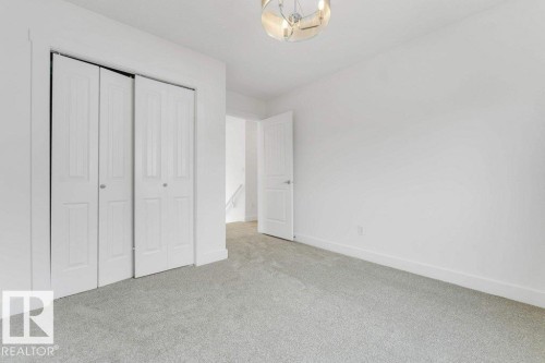 Light gray carpeting complementing white walls - 7403 Singer Landing Landing, Edmonton, AB - Indoor