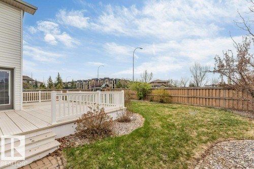 Spacious rear deck featuring composite decking and white railings - 7403 Singer Landing Landing, Edmonton, AB - Outdoor