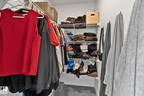 Walk-in closet featuring wire shelving, hanging rods, and carpet flooring - 21027 130 Avenue, Edmonton, AB - Indoor With Storage