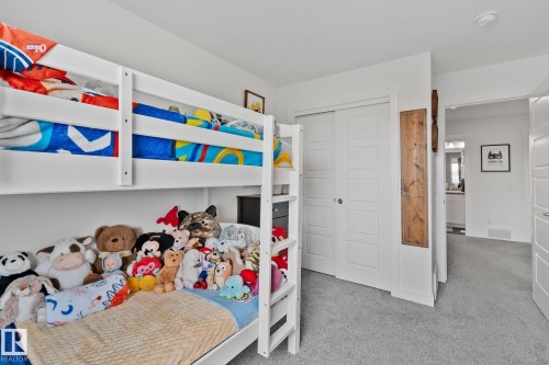 Bedroom space featuring light gray carpeting and white trim - 21027 130 Avenue, Edmonton, AB - Indoor Photo Showing Bedroom