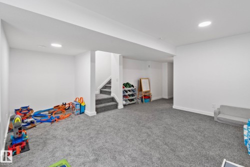 Spacious finished basement featuring recessed lighting, plush gray carpeting, white walls, and bright white trim - 21027 130 Avenue, Edmonton, AB - Indoor