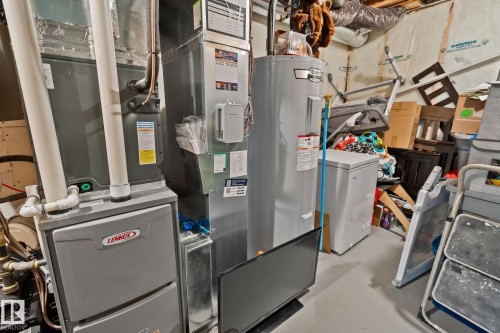 Utility space featuring a Lennox furnace, an additional HVAC unit, and a water heater - 21027 130 Avenue, Edmonton, AB - Indoor Photo Showing Basement