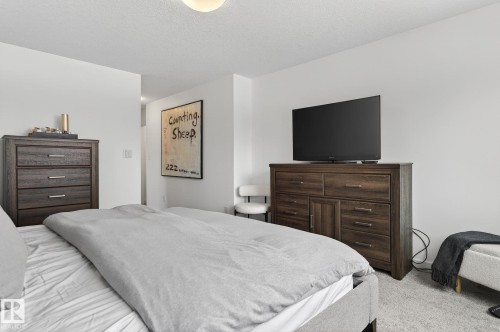 The property has light-colored walls and carpeting, creating a bright and airy atmosphere - 26 Edgewater Terr N, St. Albert, AB - Indoor Photo Showing Bedroom