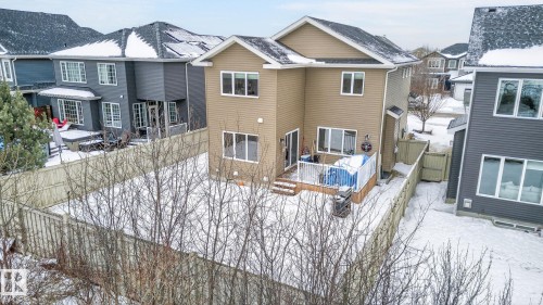 The property features a private fenced yard with a deck - 26 Edgewater Terr N, St. Albert, AB - Outdoor With Deck Patio Veranda