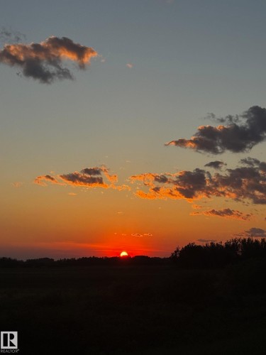 Enjoy the breathtaking views with vibrant orange and red hues across the sky - 26 Edgewater Terr N, St. Albert, AB - Outdoor With View
