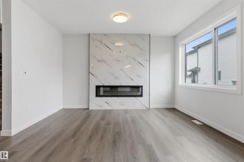 56 Meadowgrove Landing, Spruce Grove, AB - Indoor Photo Showing Living Room With Fireplace