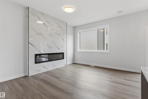 56 Meadowgrove Landing, Spruce Grove, AB - Indoor Photo Showing Living Room With Fireplace