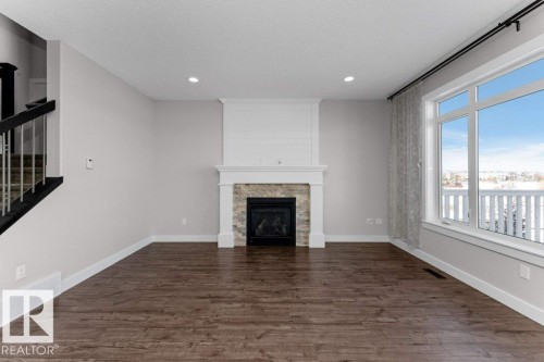 62 Ellice Bend, Fort Saskatchewan, AB - Indoor Photo Showing Living Room With Fireplace