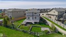 Two-story residence featuring a gray exterior and a white deck - 62 Ellice Bend, Fort Saskatchewan, AB  - Outdoor 