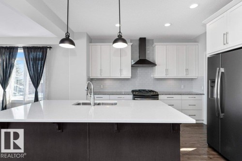 62 Ellice Bend, Fort Saskatchewan, AB - Indoor Photo Showing Kitchen With Double Sink With Upgraded Kitchen