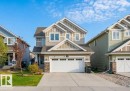 Contemporary two-story residence featuring light gray siding and stone accents - 7827 18 Avenue, Edmonton, AB  - Outdoor With Facade 