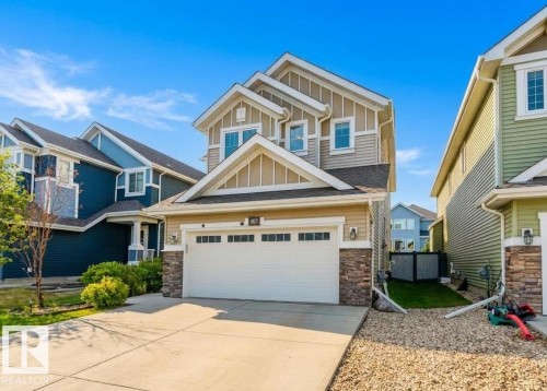 Contemporary two-story residence featuring light gray siding and stone accents - 7827 18 Avenue, Edmonton, AB - Outdoor With Facade