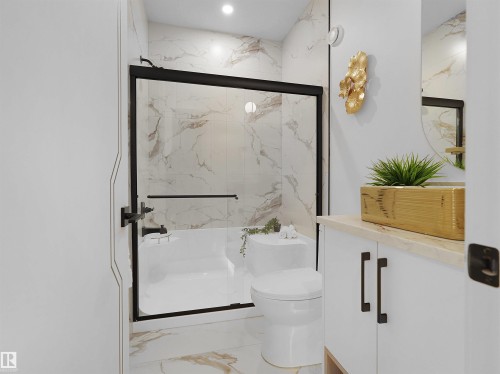 Bathroom featuring a white bathtub with a black-framed glass shower enclosure, a matching toilet, and large format veined tile flooring extending to the shower walls - 43 Eldridge Point(E), St. Albert, AB - Indoor Photo Showing Bathroom