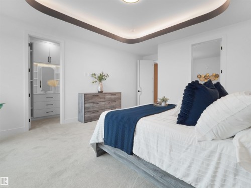 Recessed ceiling lighting with a decorative cove detail and light neutral carpeting - 43 Eldridge Point(E), St. Albert, AB - Indoor Photo Showing Bedroom