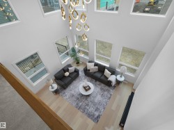 Two-story living area featuring a vaulted ceiling and an ornate chandelier - 