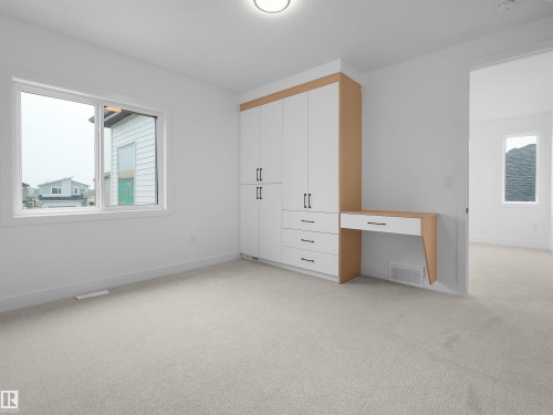 Built-in cabinetry with wood-finish accents and a dedicated desk area - 43 Eldridge Point(E), St. Albert, AB - Indoor Photo Showing Other Room
