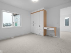 Built-in cabinetry with wood-finish accents and a dedicated desk area - 