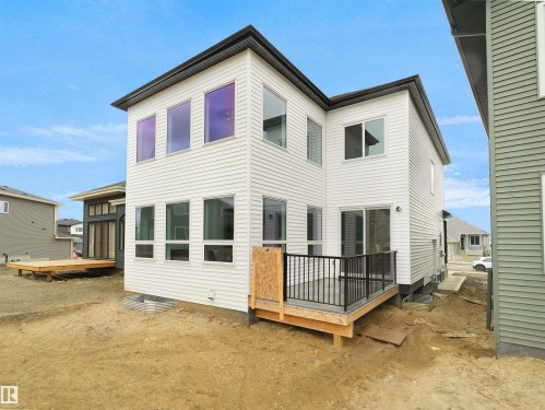Contemporary exterior featuring white siding and a black trim roofline - 43 Eldridge Point(E), St. Albert, AB - Outdoor With Deck Patio Veranda With Exterior