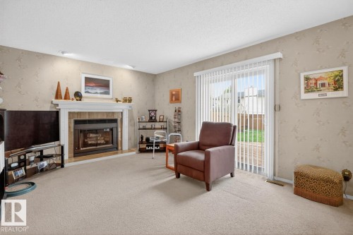 3516 37 Street, Edmonton, AB - Indoor Photo Showing Living Room With Fireplace