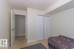 Room featuring neutral-toned walls, white trim, and carpeted flooring - 
