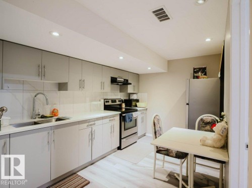7607 24 Avenue, Edmonton, AB - Indoor Photo Showing Kitchen With Double Sink
