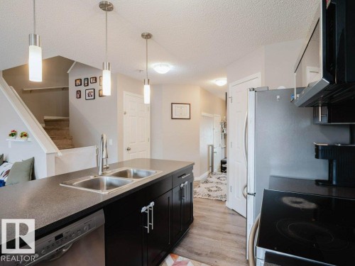 7607 24 Avenue, Edmonton, AB - Indoor Photo Showing Kitchen With Double Sink