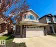 Two-story residence featuring light-colored siding and a two-car garage - 4875 Wright Drive, Edmonton, AB  - Outdoor With Facade 