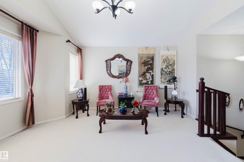Spacious room with light-toned carpeting and multiple windows - 1764 Melrose Crescent, Edmonton, AB 