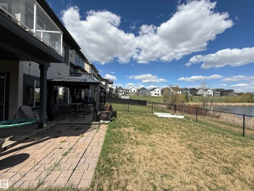 Paved patio area with a covered outdoor seating space - 1007 173 Street, Edmonton, AB - Outdoor With Deck Patio Veranda With View