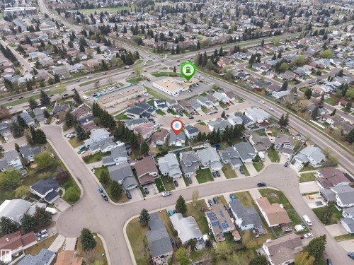 Aerial view showcasing a residential neighborhood with established homes, mature trees, and well-maintained streets - 1529 49A Street Nw, Edmonton, AB - 
