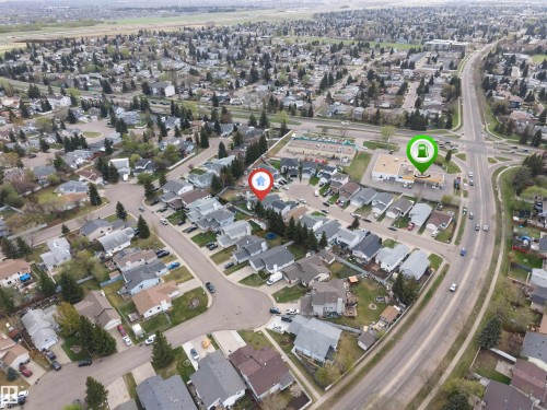 Aerial perspective showcasing a residential neighborhood with a mix of single-family homes and mature tree coverage - 1529 49A Street Nw, Edmonton, AB - Outdoor With View