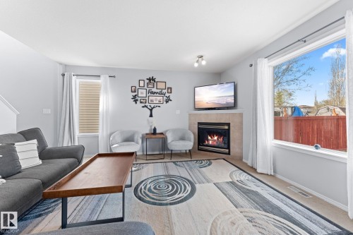 2124 35A Avenue, Edmonton, AB - Indoor Photo Showing Living Room With Fireplace