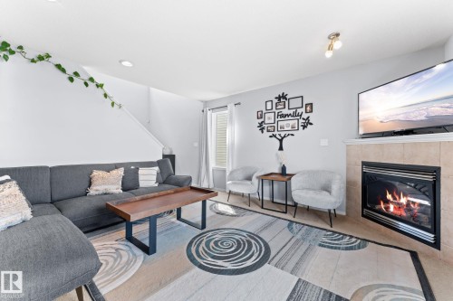 2124 35A Avenue, Edmonton, AB - Indoor Photo Showing Living Room With Fireplace