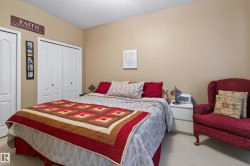 Neutral-toned walls complement the carpeted flooring - 